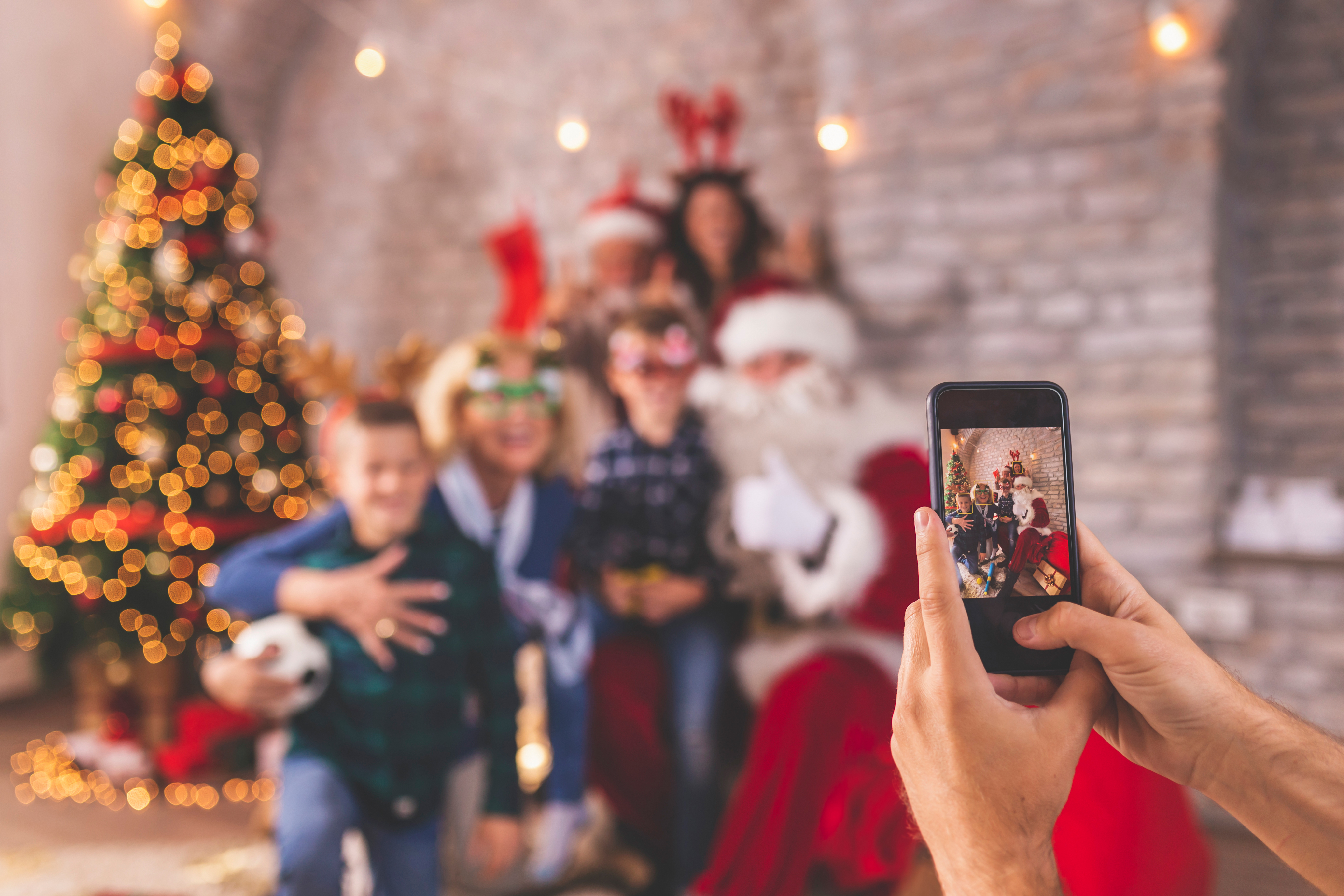 family-taking-photos-with-santa-claus-2022-10-20-19-01-38-utc