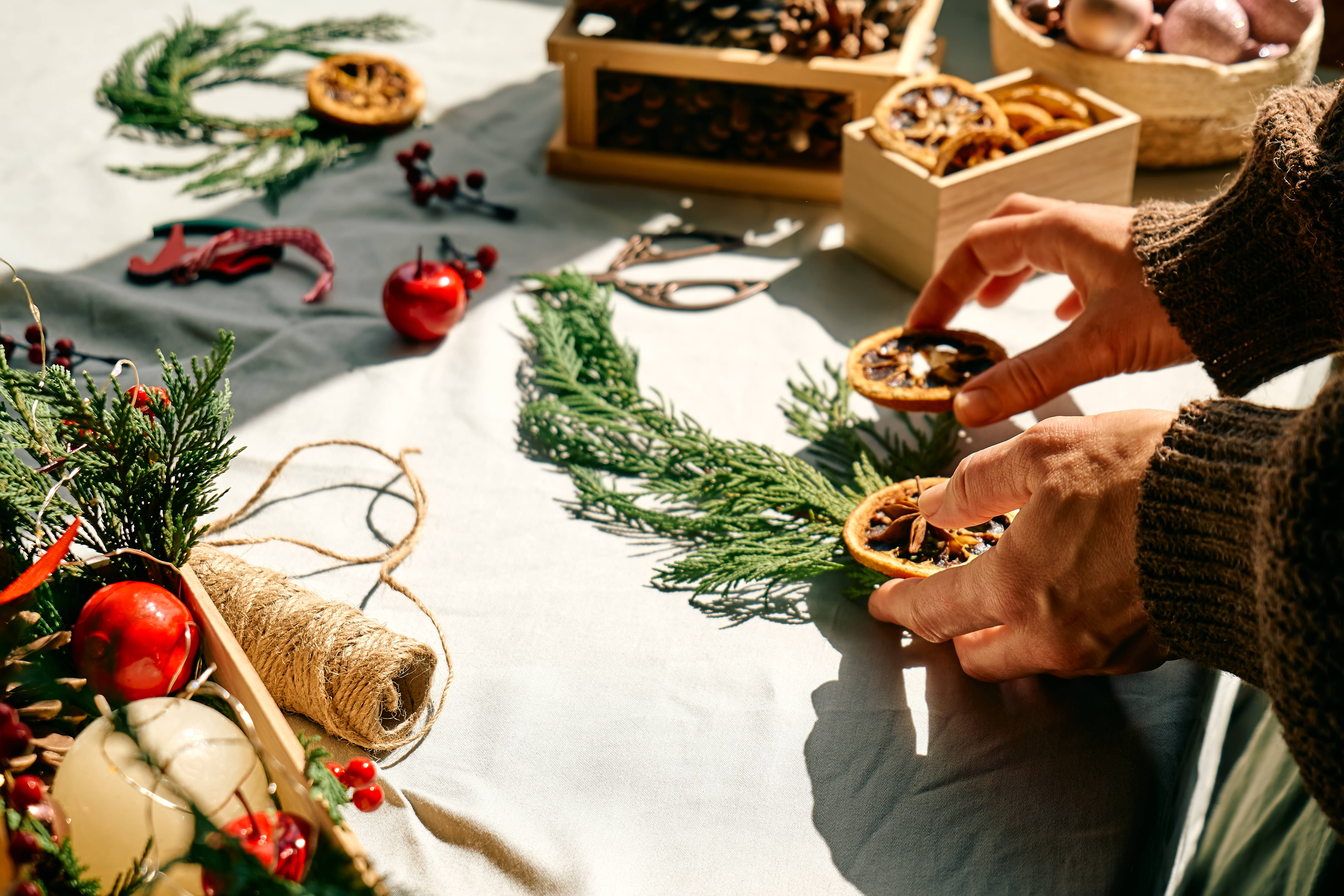 female-florist-creating-winter-ikebana-with-fresh-2023-11-27-05-15-31-utc